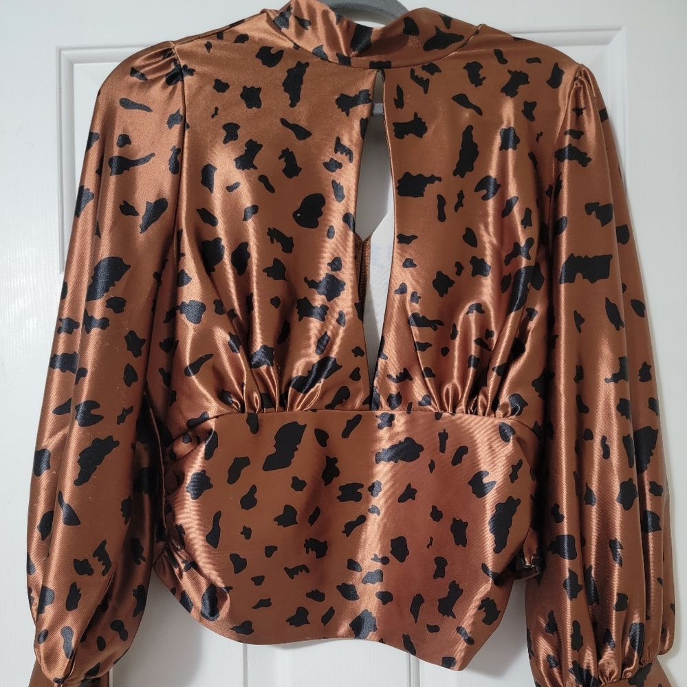 Cute Blouse ruffle on bottom of each side zips on one side